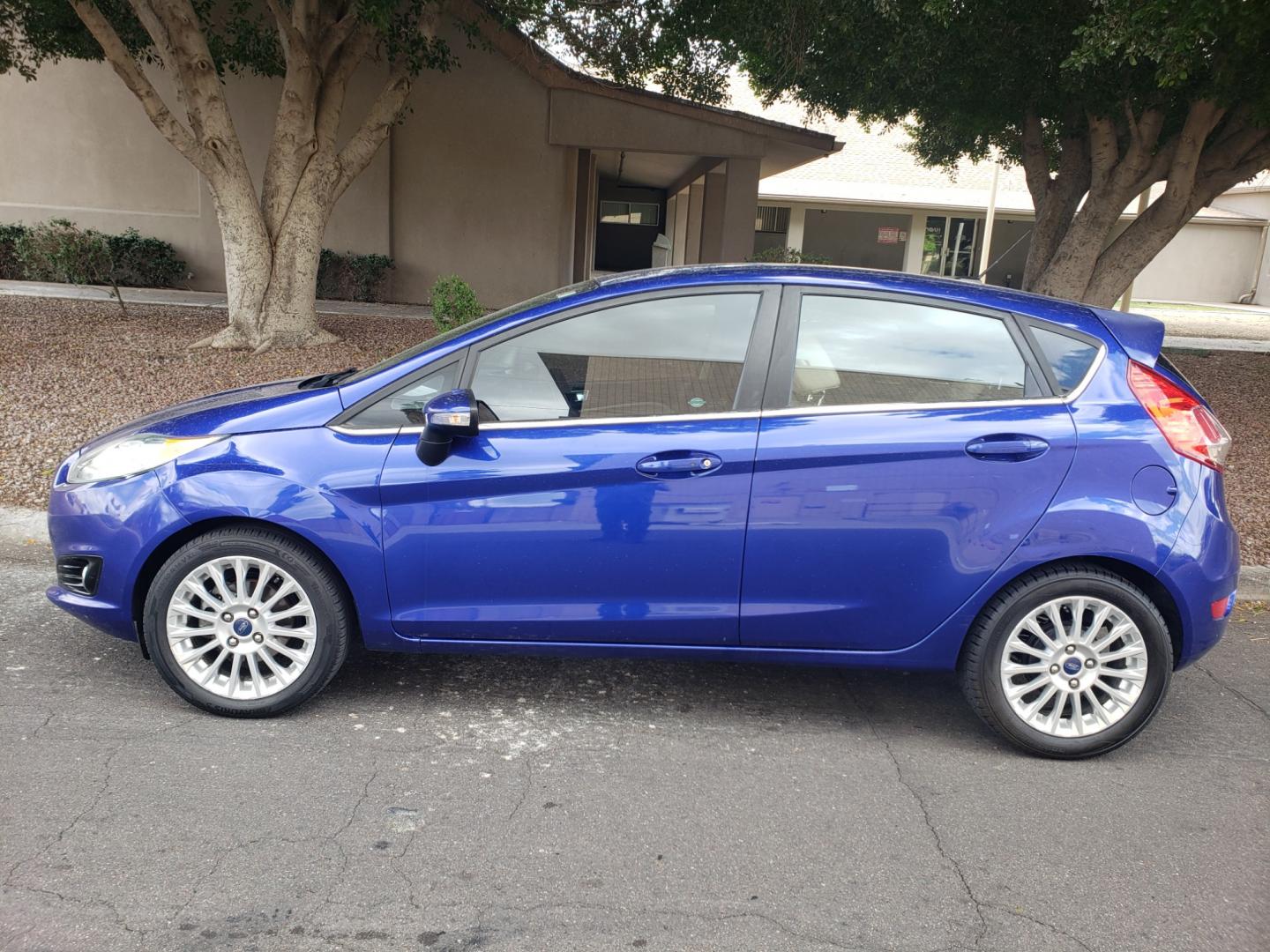 2014 /Tan and black Ford Fiesta Titanium (3FADP4FJ5EM) with an 1.6l i4 engine, 6-Speed Automatic transmission, located at 323 E Dunlap Ave., Phoenix, AZ, 85020, (602) 331-9000, 33.567677, -112.069000 - 2014 Ford Fiesta Titanium,.......A Must See!!... No accidents, Only 95K MILES.... Ice cold AC. The car is gorgeous inside and out. Power windows, Power door locks, Touch screen Stereo/ CD Player, Phone sync, Bluetooth, Satellite compatible, Backup camera, Beautiful tan and black interior with tan le - Photo#6